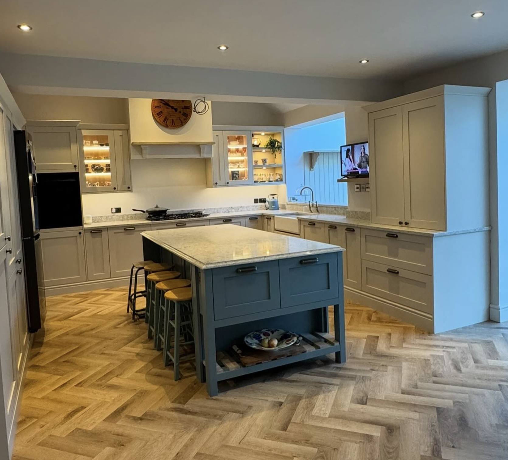 Bespoke kitchen with island and herringbone floor in Newmarket by Cromwell Interiors